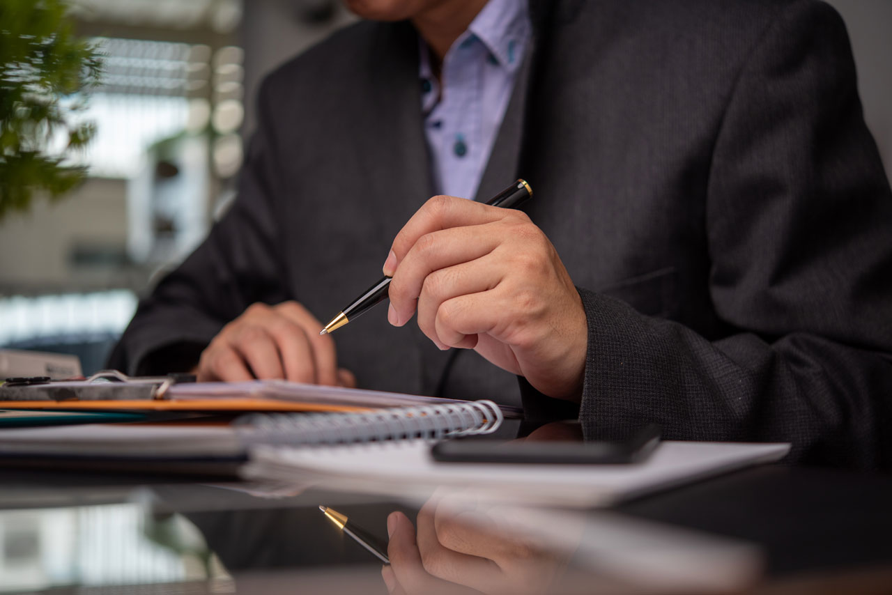 istockphoto-1346156665-2048x2048 A close up of an attorney holding a pen