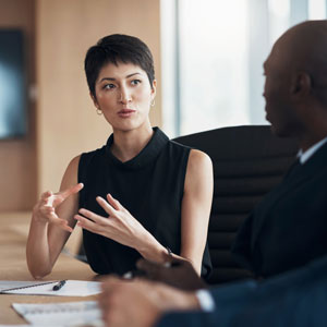 istockphoto-1477040221-2048x2048-crop A young attorney is explaining her legal case with the client