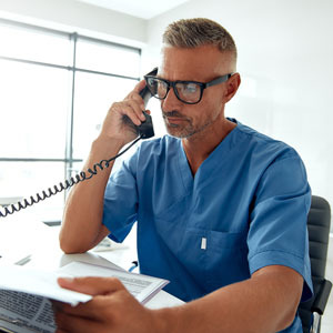 A medical provider speaking on the phone with Bashore Green Law Group
